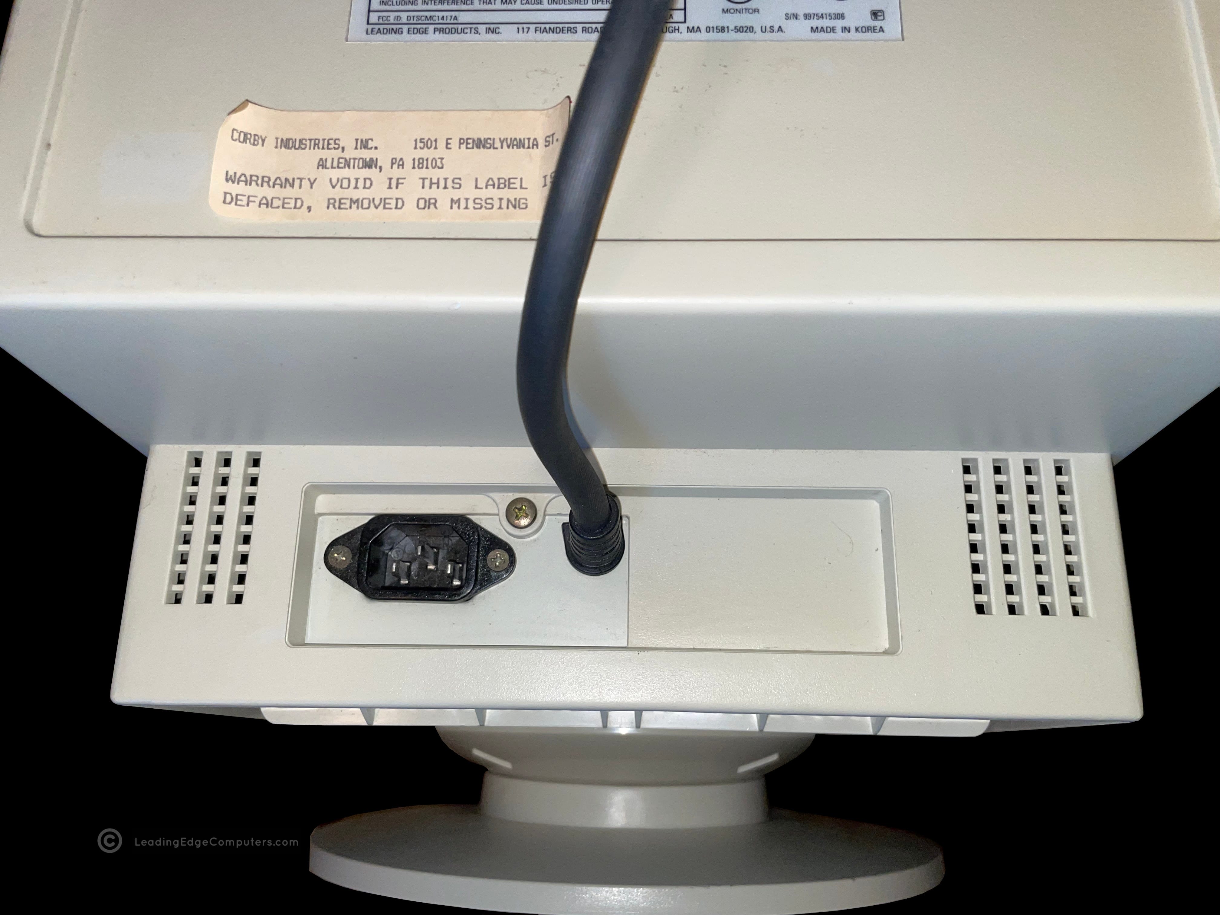 detail view of cmc 1417ae power plug and vga cable