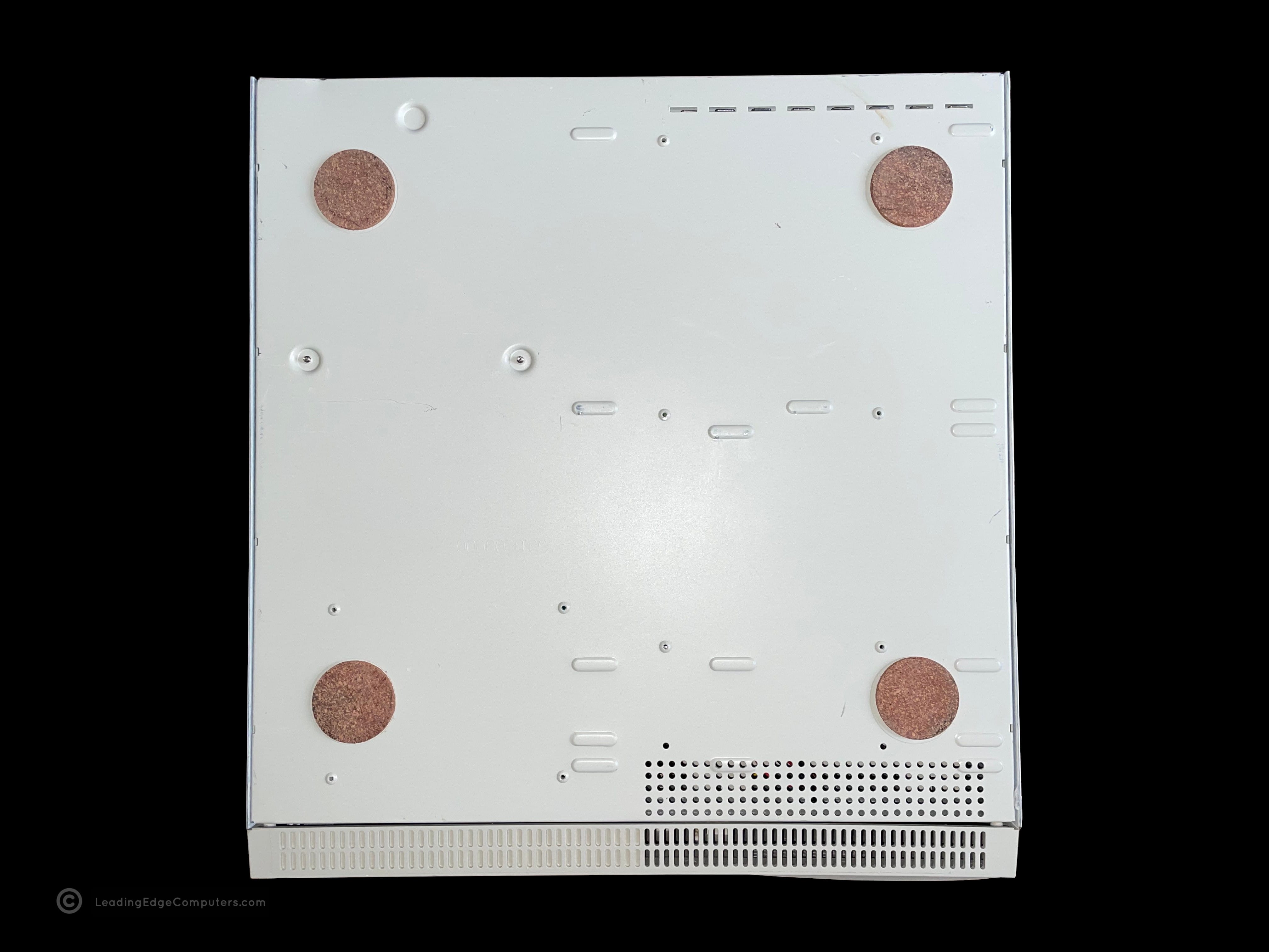 A picture of the bottom of a Fortiva 5000 CPC 2800 computer showing the cork feet
