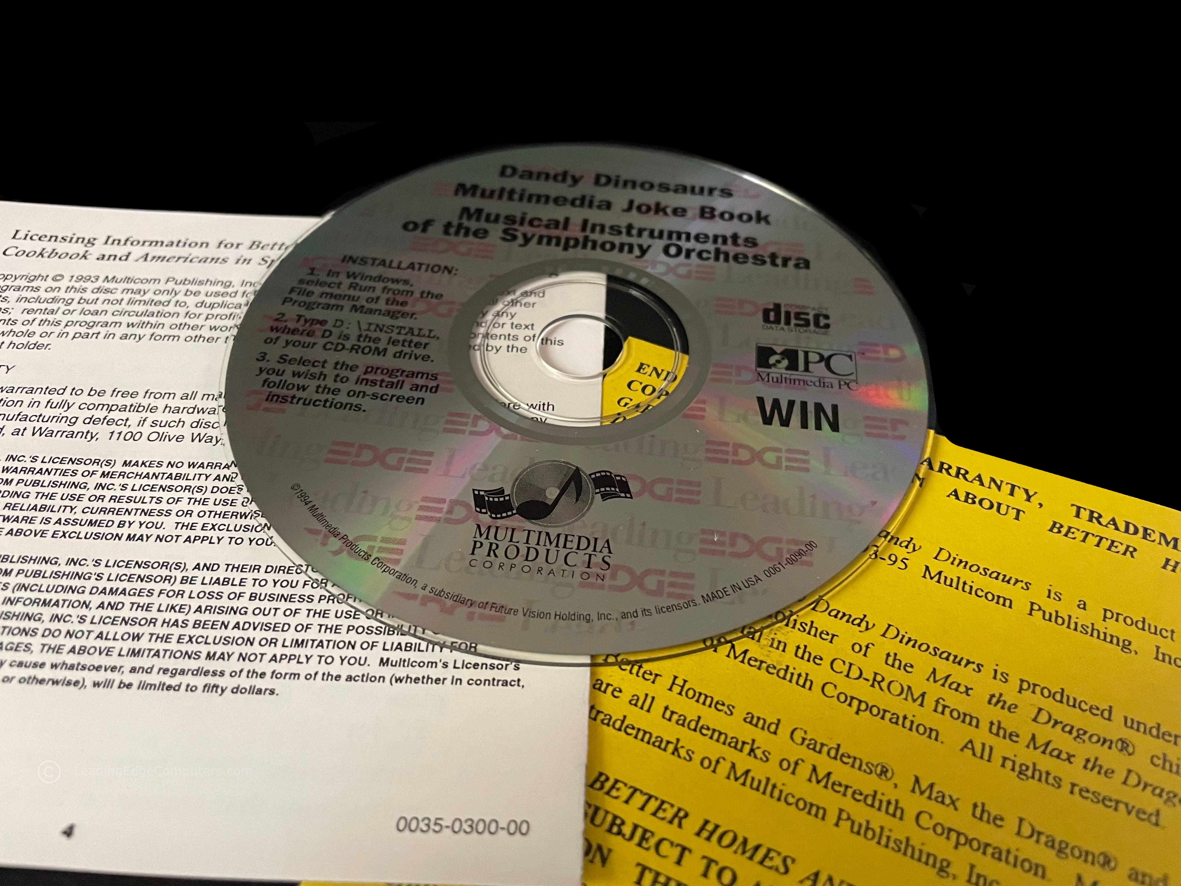 A picture of the CD-ROM labeled with Leading Edge branding with Dandy Dinosaurs, Multimedia Joke Book, and Musical Instruments of the Symphony Orchestra